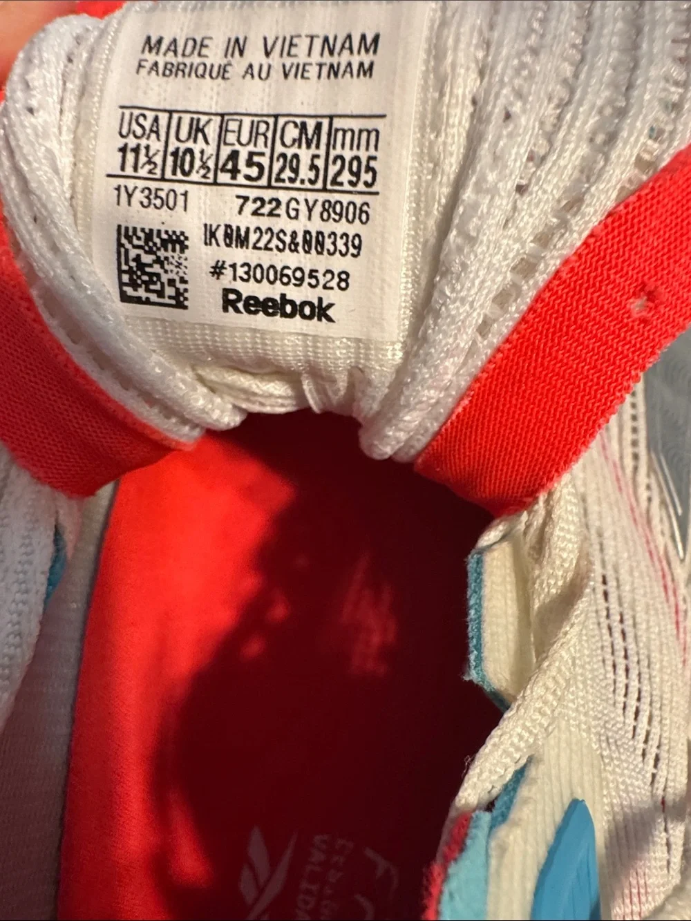Reebok Nano Froning X2 Men’s White Athletic Sneakers with Red and Blue Accents